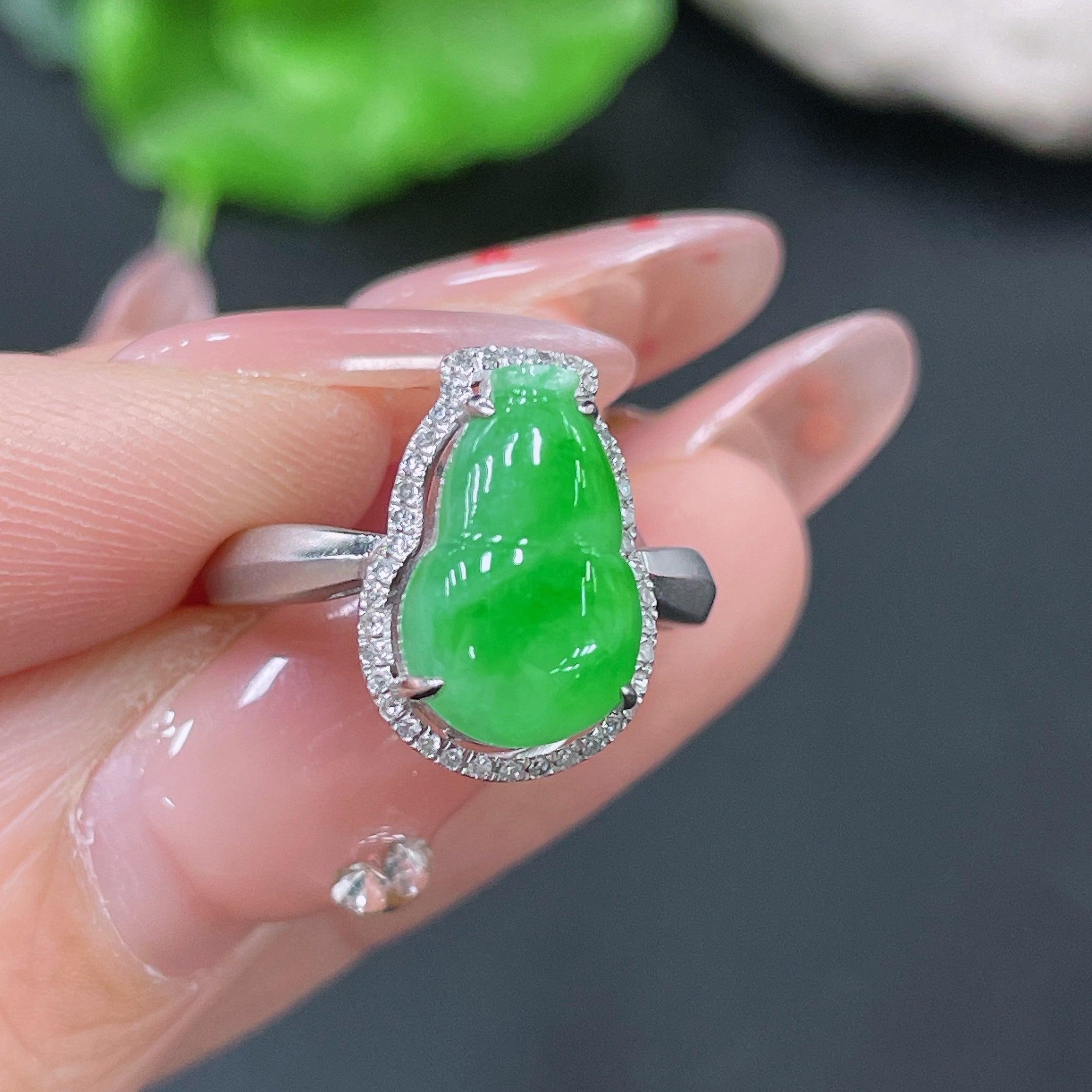 Jadeite ring set in 18k gold with diamonds, size 11, featuring a polished green jade gemstone and intricate gold detailing.
