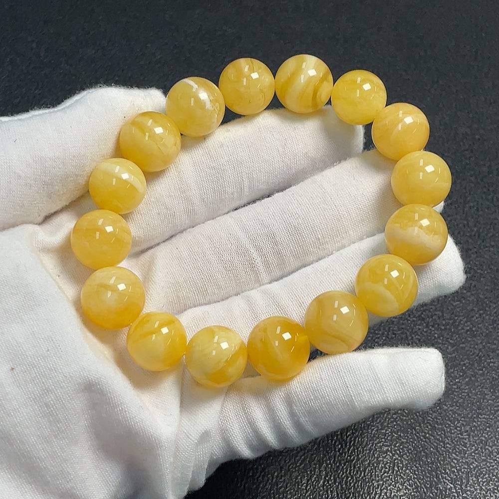 Huiliu Amber Beeswax Bracelet with 12.7mm beads, natural amber jewelry featuring warm honey tones and a smooth polished surface.