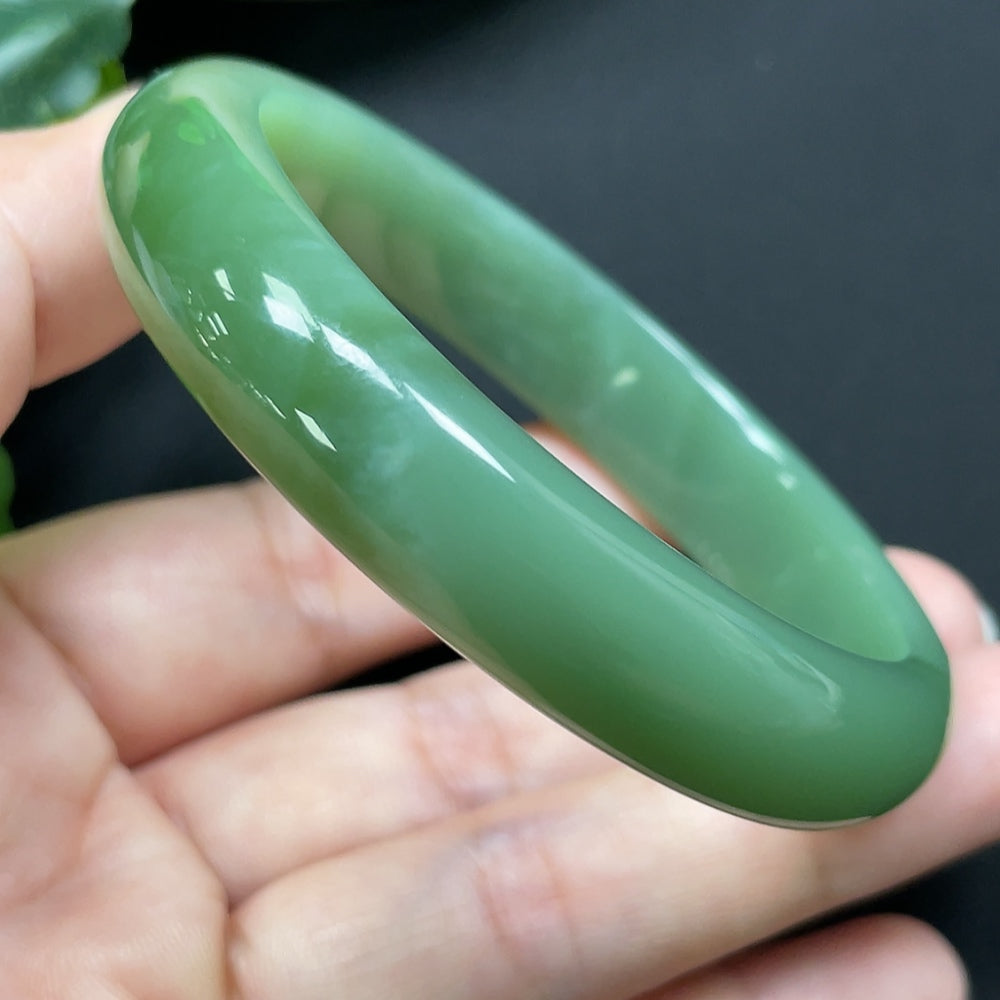 HKHQ Hetian Jade round bracelet, 56.1mm, weighing 44.72g, showcasing smooth, polished jade beads on a natural jewelry piece.