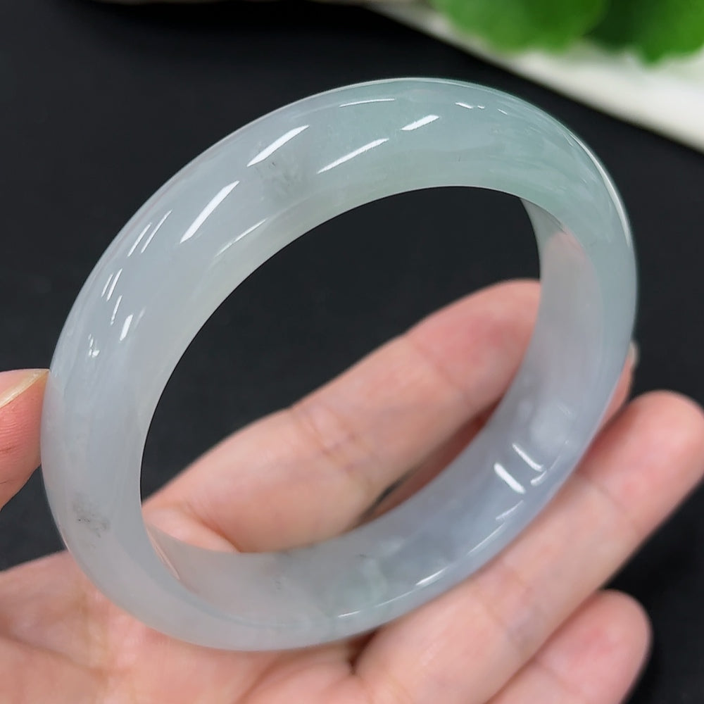 HKHQ jadeite round bangle, size 59.1, crafted from high-quality jade, weighs approximately 65.8g, showcasing smooth, polished surface.