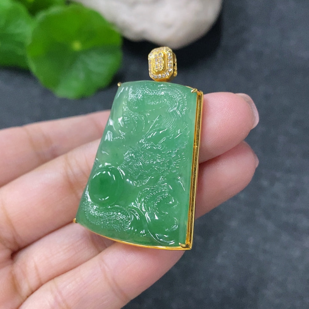 Huiliu Jadeite dragon pendant with diamond accents, detailed carved jade jewelry, oval shape, hanging from a chain.