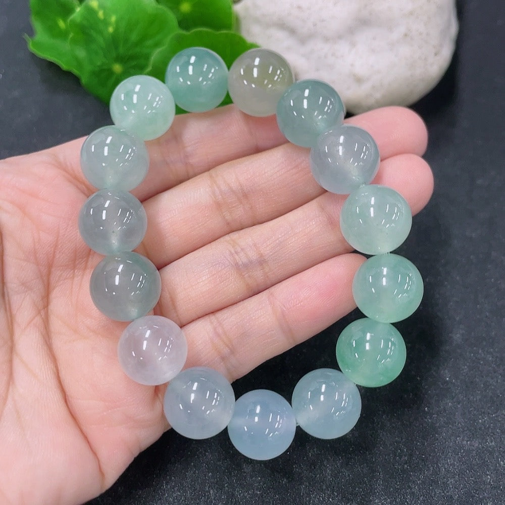 HKHQ jadeite bracelet with 13.4mm maximum size, 56.13g weight, featuring smooth, polished jadeite beads.