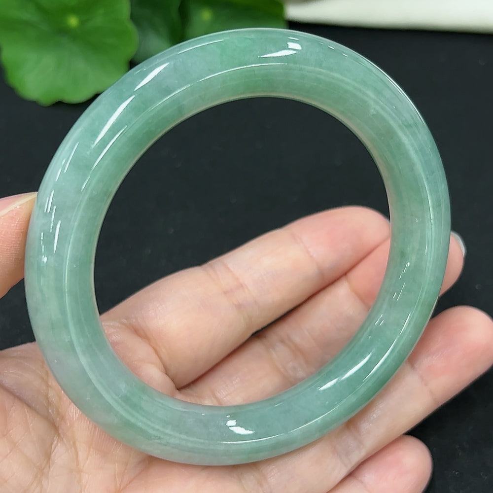 HKHQ jadeite round bangle in size 57.7, weighing 68.6g, showcasing smooth, polished jadeite with a rounded design.