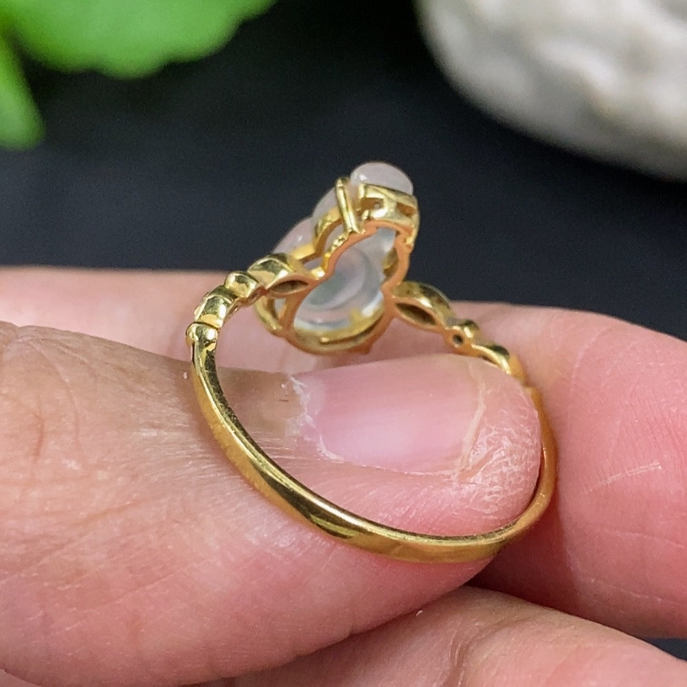 Jadeite gourd ring with 18K gold band, featuring a smooth, polished jadeite stone and gold detailing, designed by HKHQ.