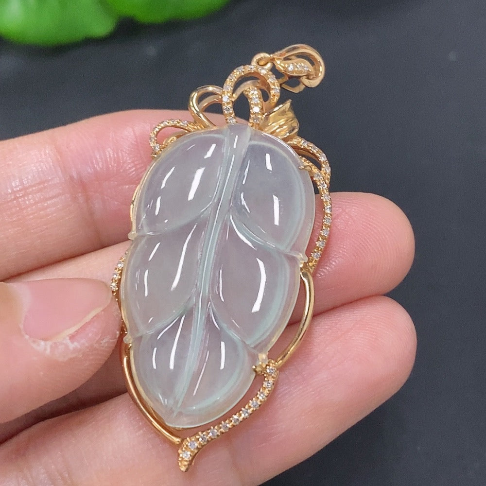 Jadeite leaf pendant with diamond accents in 18k gold, HKHQ jewelry, showing detailed leaf design and polished finish.