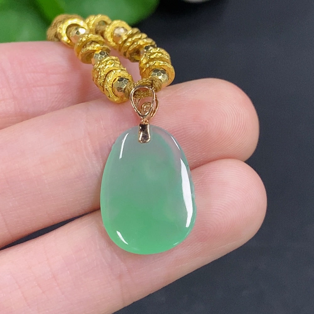 Jadeite Ruyi pendant with 18K gold accents and diamond details, featuring a jade pendant on a cord, weighing approx. 4.78g.