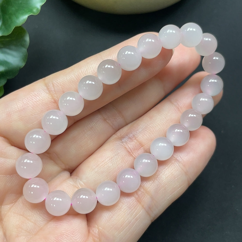 HKHQ Hetian Jade bracelet with 7.7mm beads, showcasing smooth, polished green jade stones on a delicate bracelet.