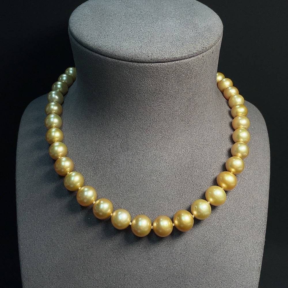Huiliu certified seawater pearl strand with 9.2-12.1mm iridescent pearls, natural color, elegant jewelry piece.