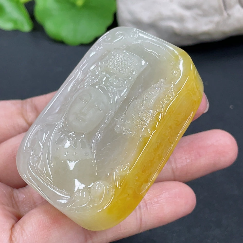 Jadeite Guanyin pendant in green jade, weighing approximately 64.7g, featuring detailed carved Buddhist deity figure.