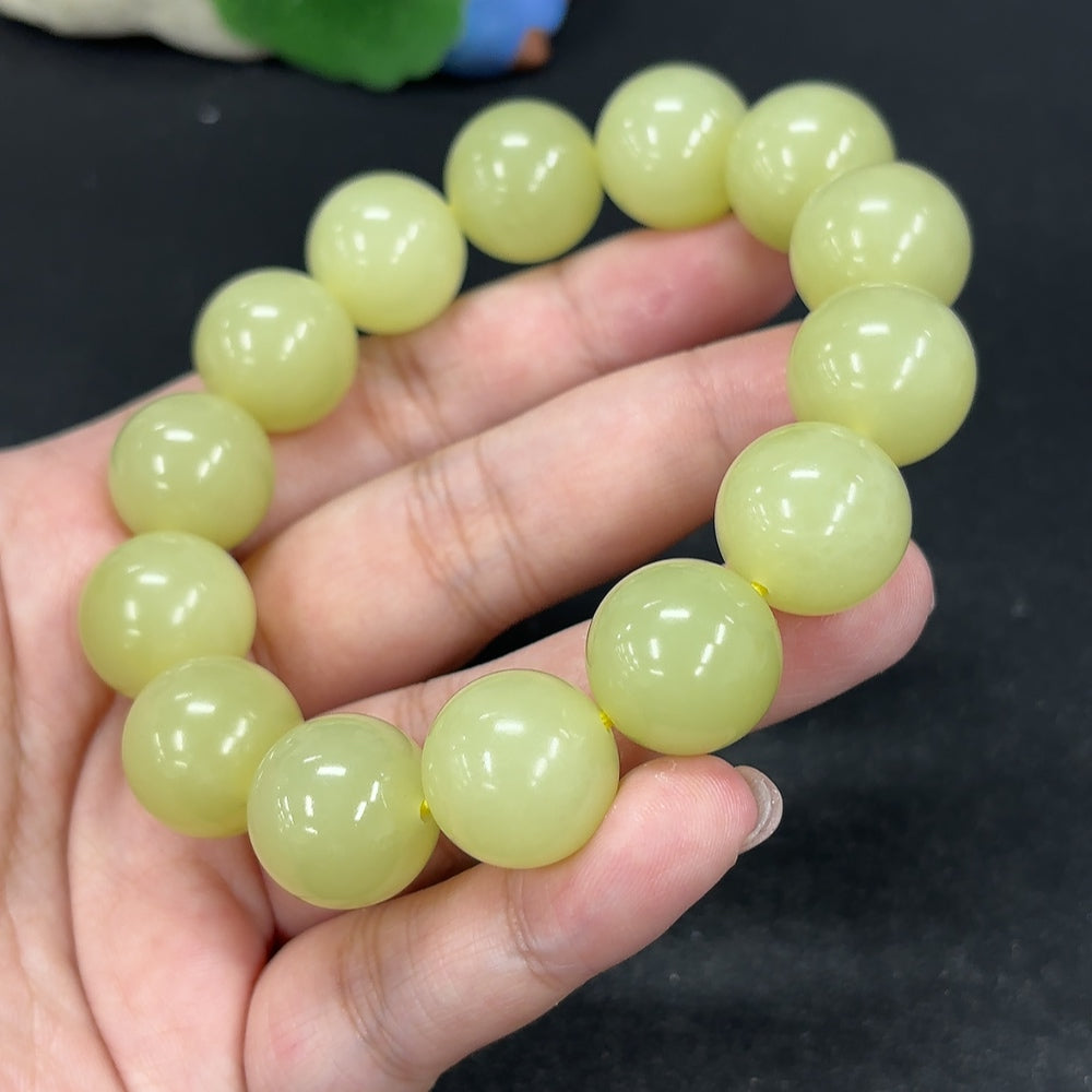 HKHQ Hetian jade bracelet, 15.9mm beads, weighing 91.4g, showcasing smooth green jade stones on a jewelry image.
