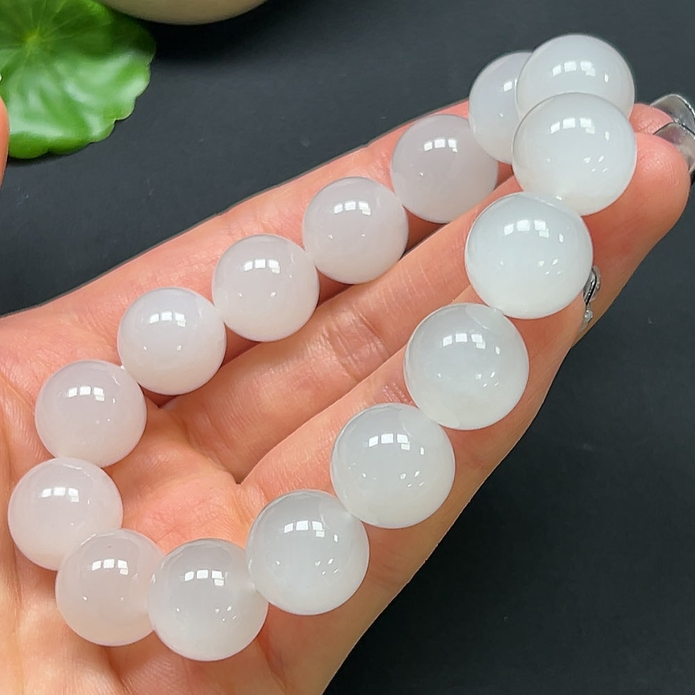 HKHQ Hetian Jade bracelet with 14mm round beads, showcasing smooth, polished green jade on a neutral background.