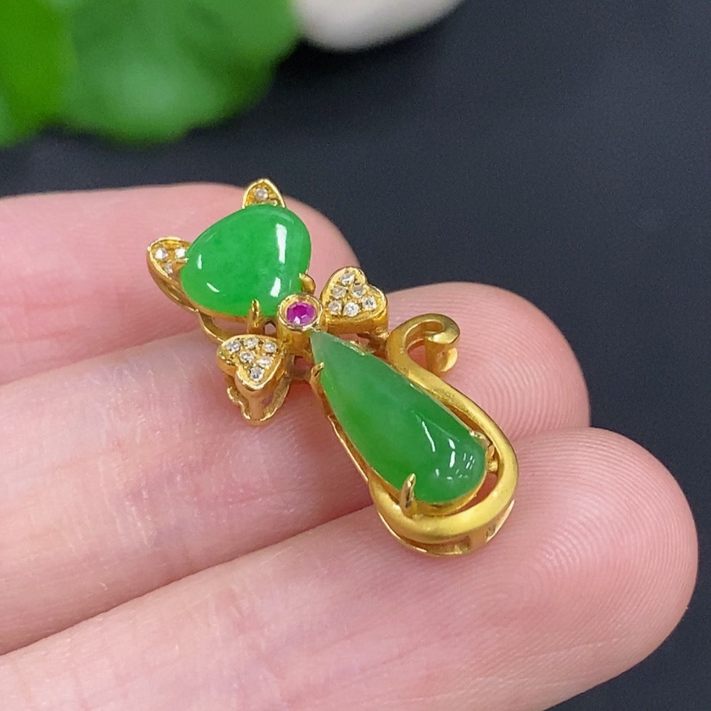Jadeite pendant with diamond accents on 18K gold necklace, elegant jewelry piece with intricate design and polished finish.