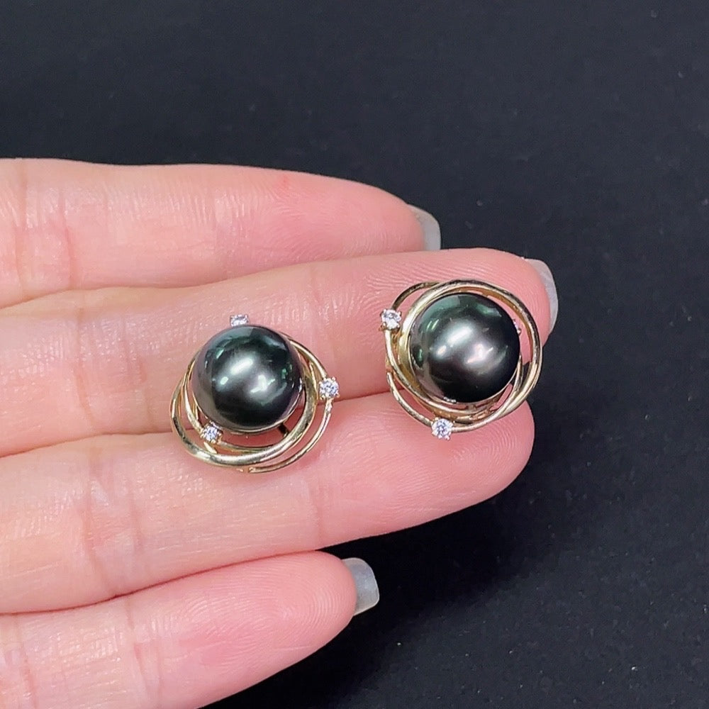 Saltwater pearl stud earrings in 14K gold by HKHQ, featuring elegant round pearl designs on a white background.
