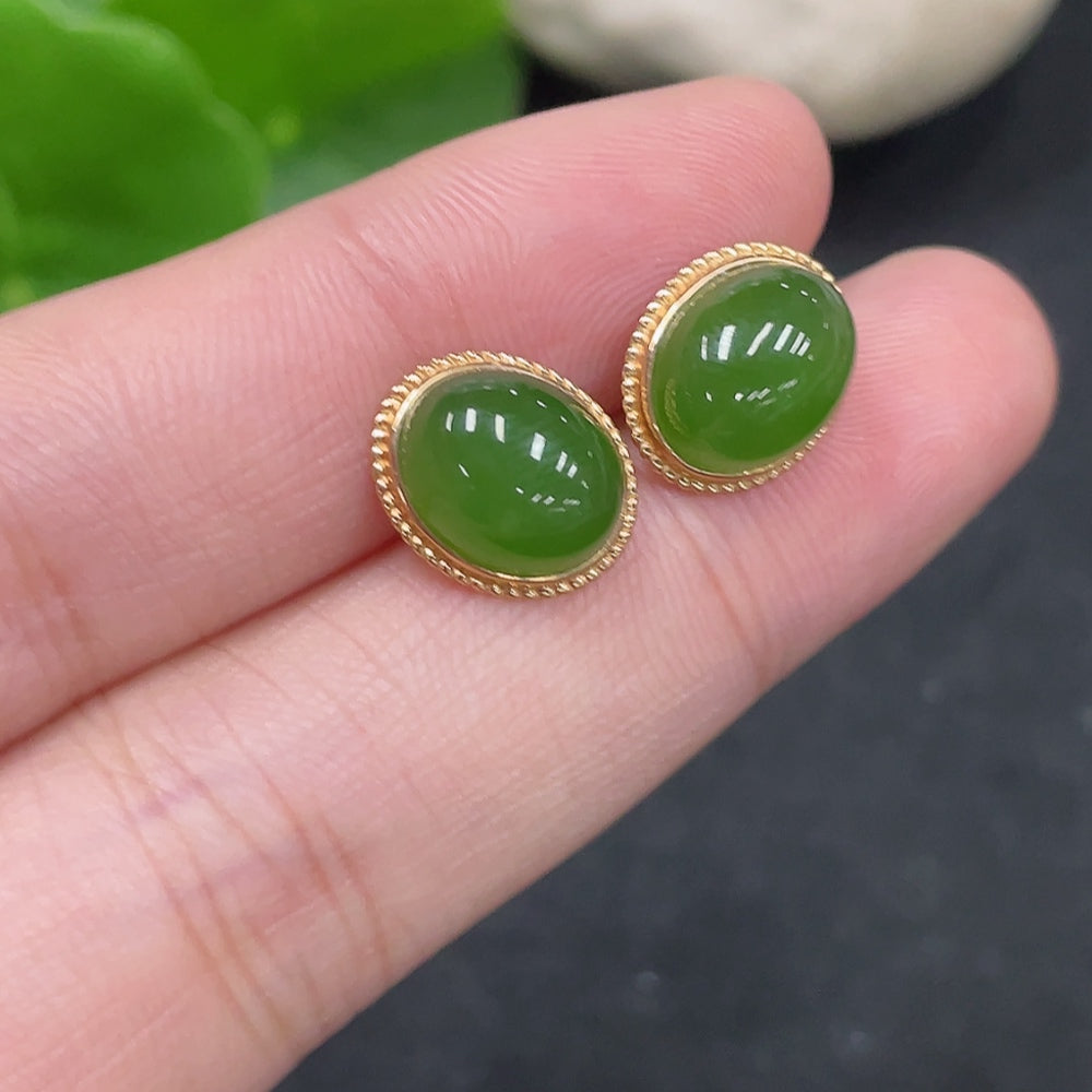 Huiliu certified Hetian jade cabochon earrings with delicate setting and silver hooks, showcasing smooth, polished jade stones.