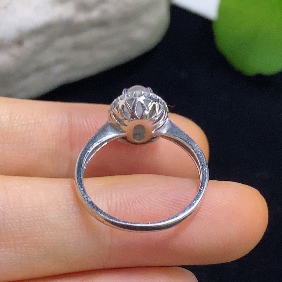 Jadeite cabochon solitaire ring with 18K gold band and diamond accents, showcasing elegant gemstone and fine jewelry craftsmanship.