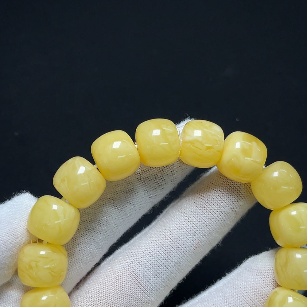 Amber Beeswax Bracelet by HKHQ, natural honey-colored beads, crafted bracelet with a rustic finish, weight 26.18g.