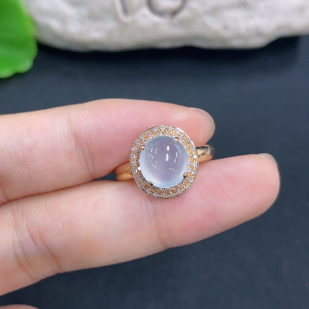 Jadeite ring with 18k gold band and diamond side stones, size 14, featuring a smooth jade gemstone and intricate gold detailing.