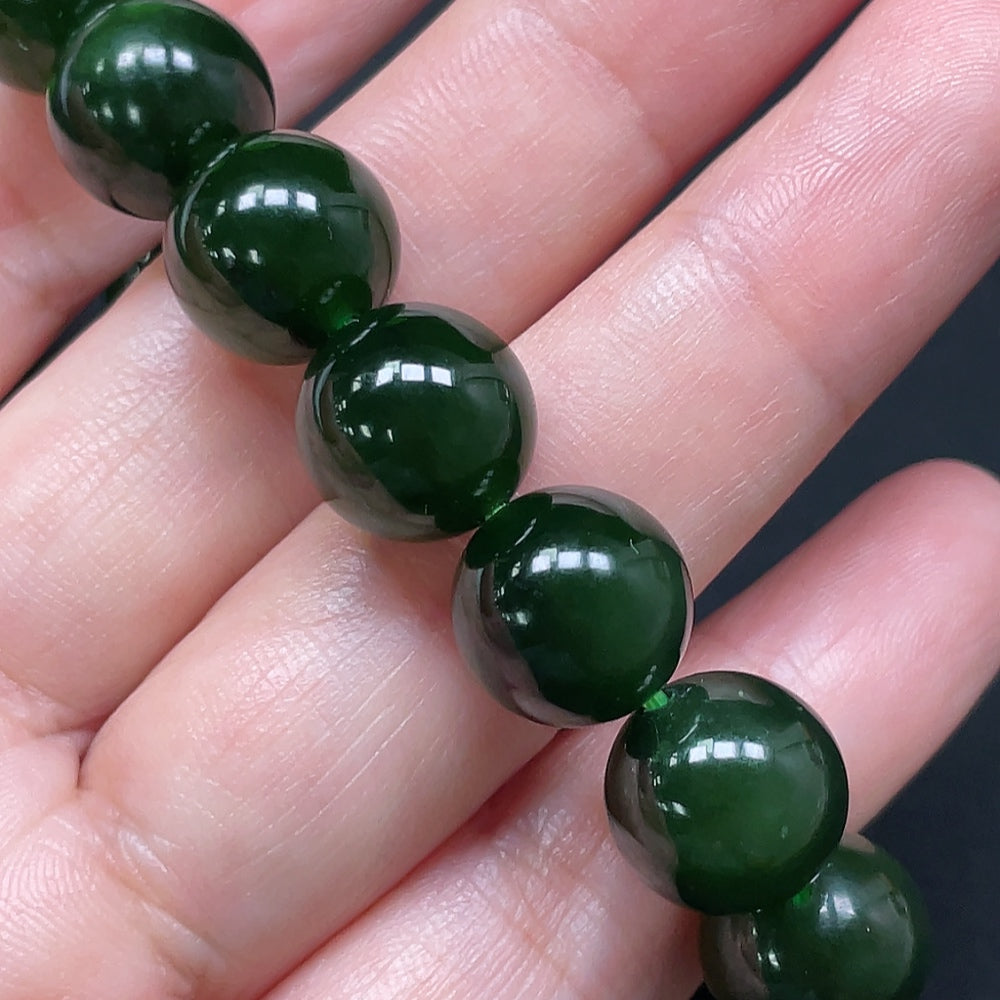 HKHQ Hetian Jade bracelet with 11.9mm beads, totaling approximately 45.24g, showcasing smooth, polished jade stones.