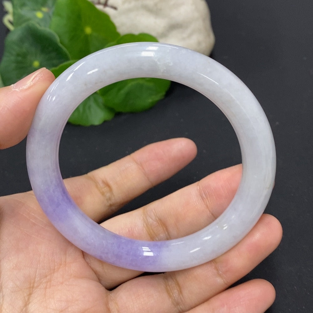 HKHQ jadeite round bangle with mineral components, 55.8mm size, weighing approximately 49.81g, showcasing smooth, polished surface.