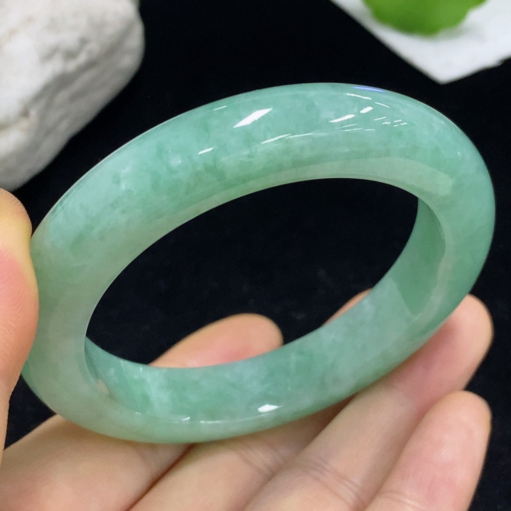 Jadeite round bracelet from HKHQ, weighing approximately 57.71g, with a size of 53, showcasing smooth, polished green jade stones.
