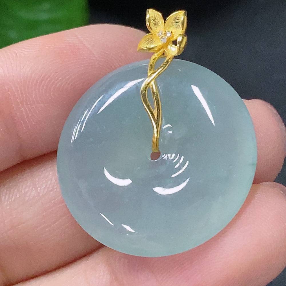 Jadeite pendant with peace knot design, 18K gold accents and diamond details, crafted by HUILIU HQ.