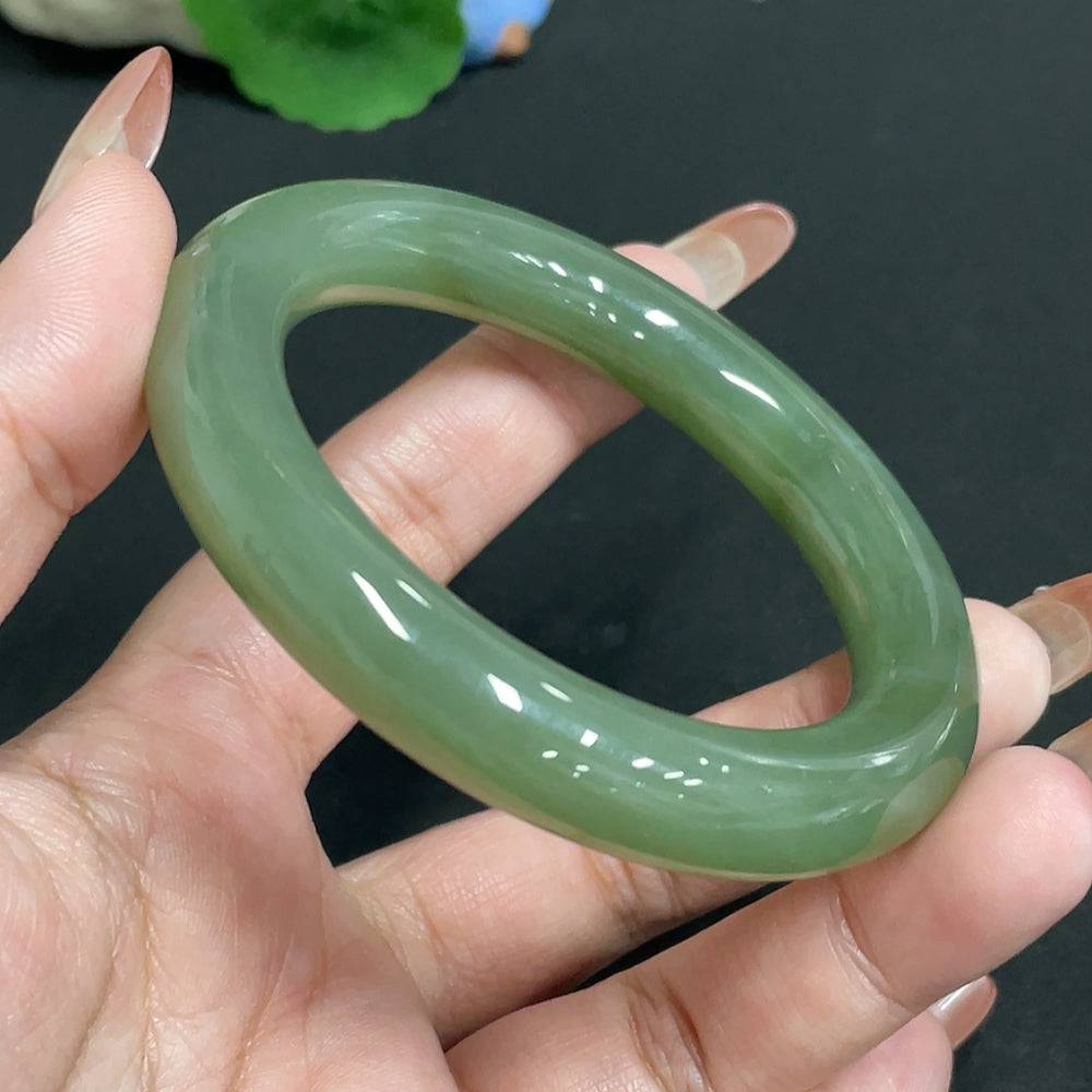 HUILIU HQ Hetian Jade round bangle with size 56.7 and weight approximately 63.7g, showcasing smooth, polished jade surface.