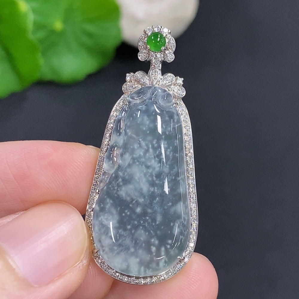 Jadeite auspicious gourd pendant with 18K gold accents and diamond details, showcasing intricate craftsmanship and elegant design.