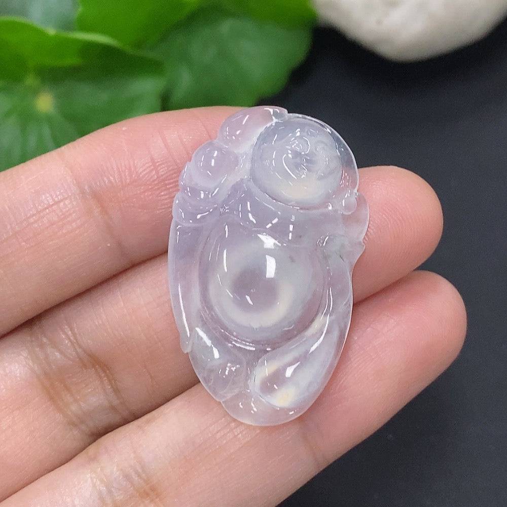 Huiliu Jadeite Buddha pendant hanging from a cord, showcasing smooth green jade with carved Buddha design.