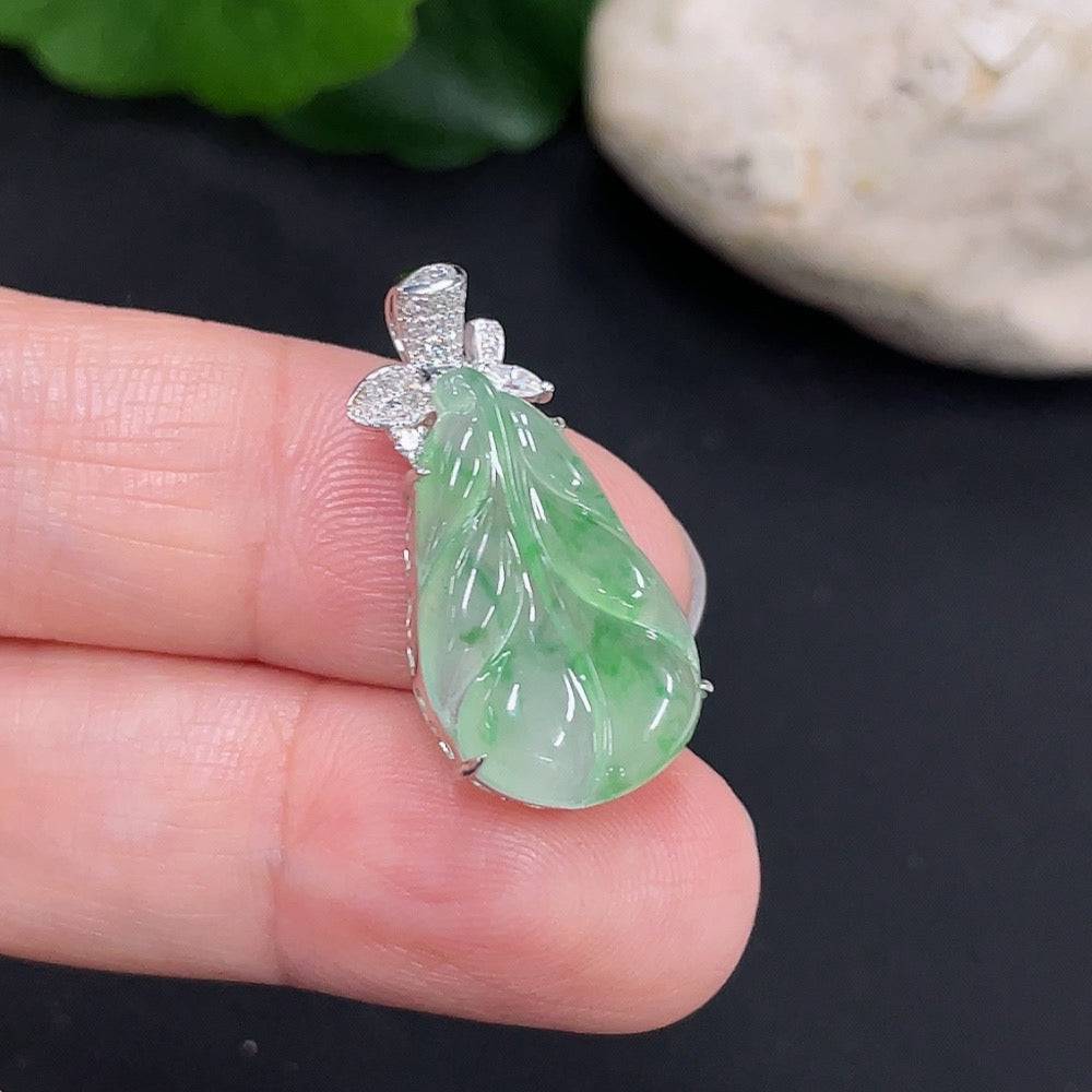 Large green jade pendant from HUILIU HQ, showcasing smooth polished surface and natural stone texture.