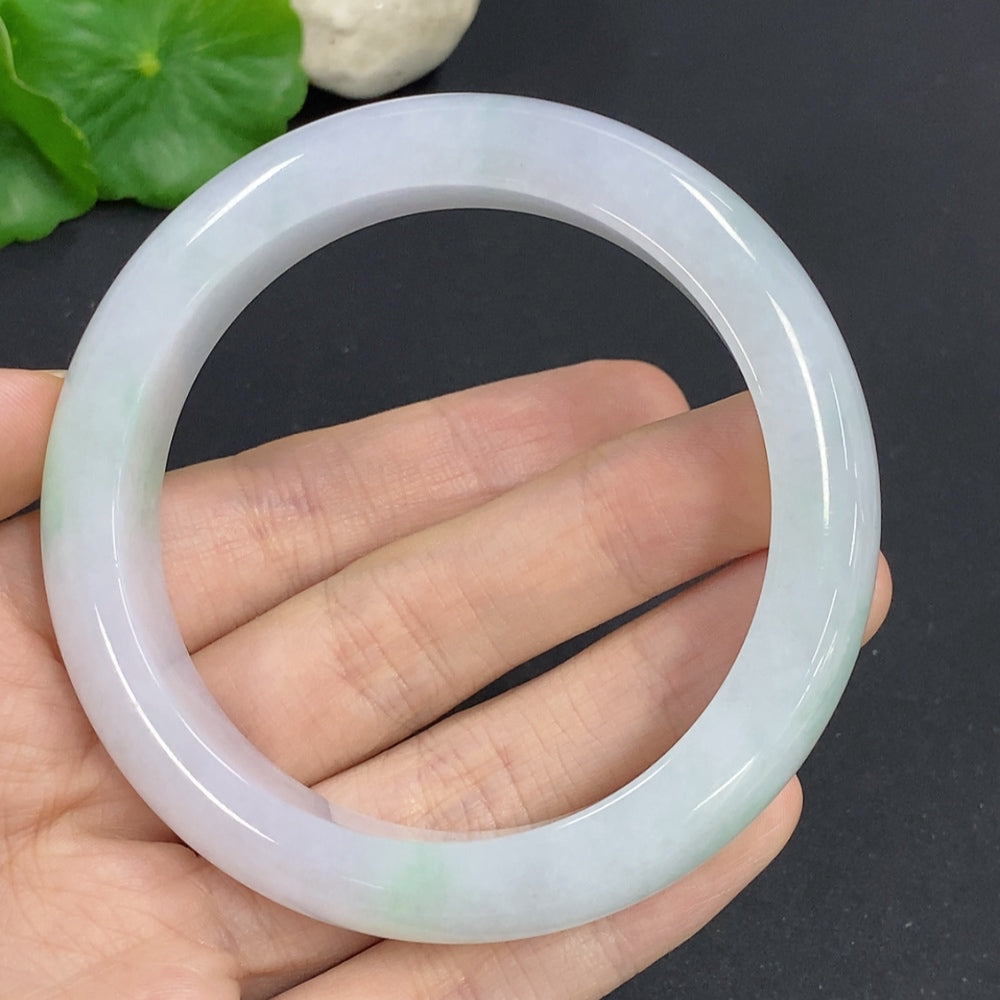 Jadeite round bangle with size 58.7 and weight 68.3g, made of polished green jade, displayed on a neutral background.