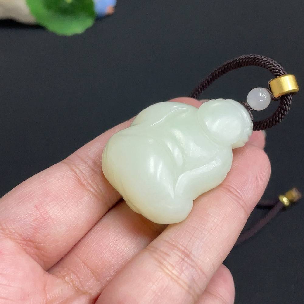 Hetian jade pendant featuring the God of Wealth, weighing approx. 34.8g, crafted from high-quality jade with a decorative rope.