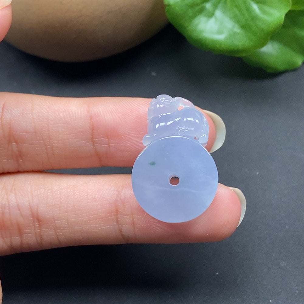 Jadeite pendant featuring a Pixiu design from HKHQ, carved from smooth green jade, displayed on a neutral background.