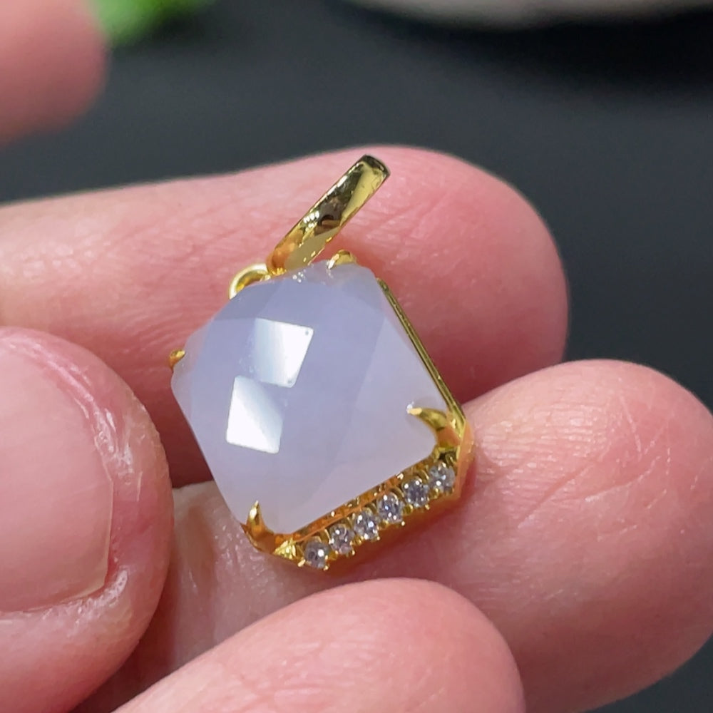 Huiliu Jadeite pendant with diamond accents on a silver mount, showcasing a polished green jade gemstone.