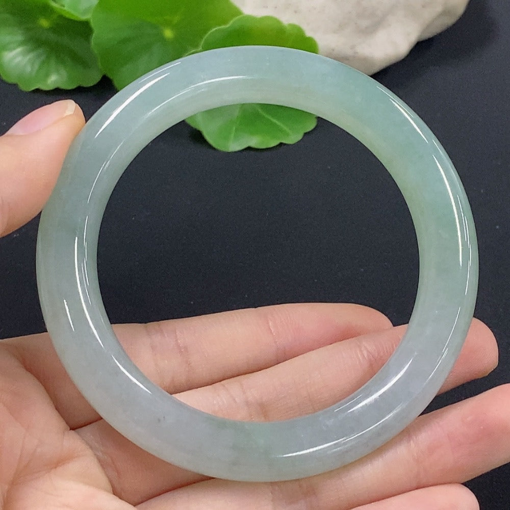 HKHQ jadeite round bangle in size 56, showcasing smooth jade surface and a weight of approximately 54.11 grams.