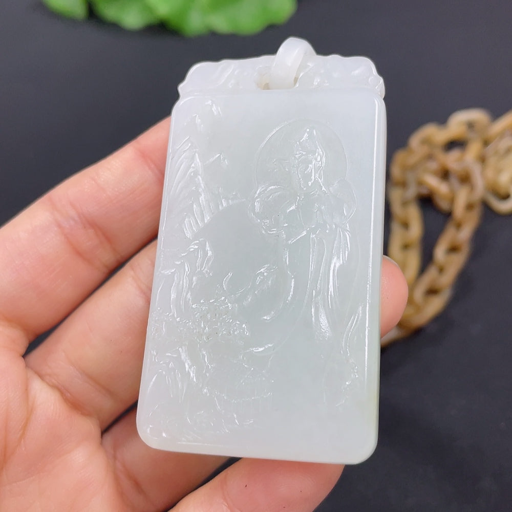 Huiliu certified Hetian jade Guanyin pendant with visible splicing craftsmanship, showcasing intricate carving and smooth surface.