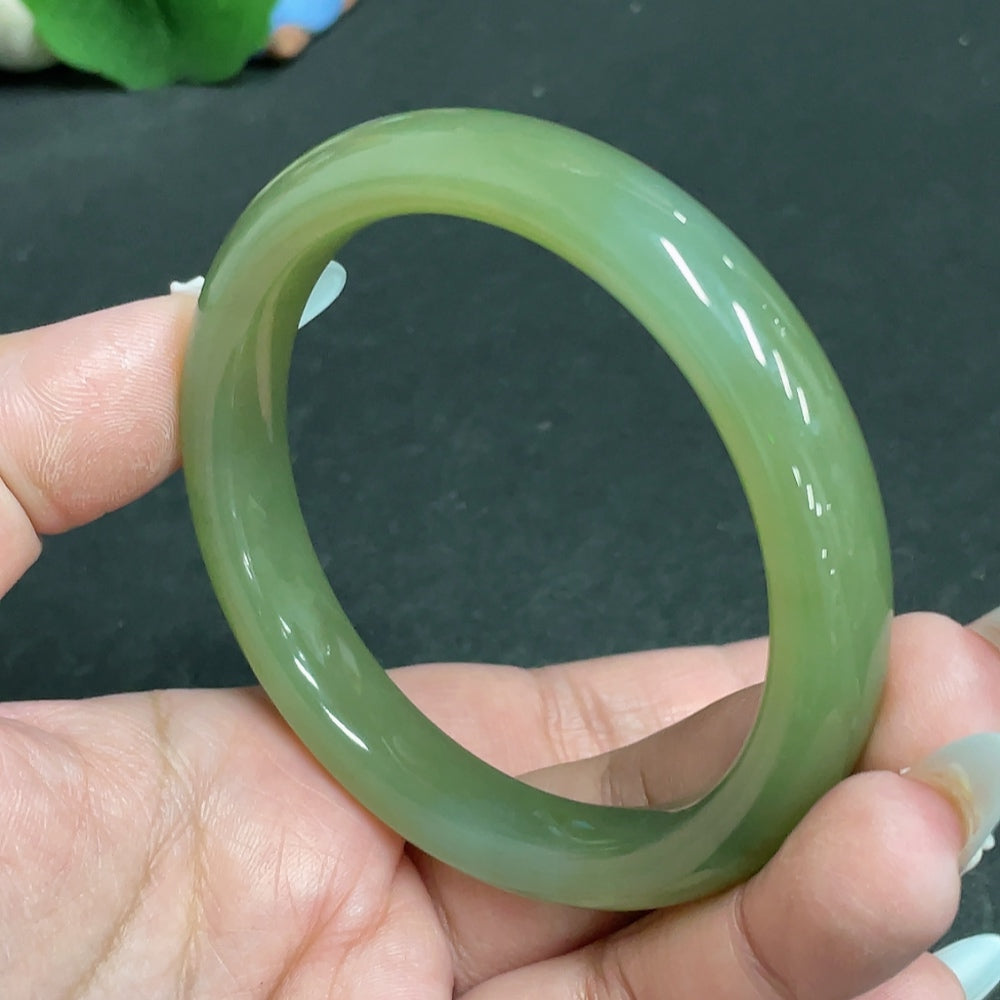 Huiliu certified Hetian jade round bracelet featuring smooth, polished jade beads on a delicate string.