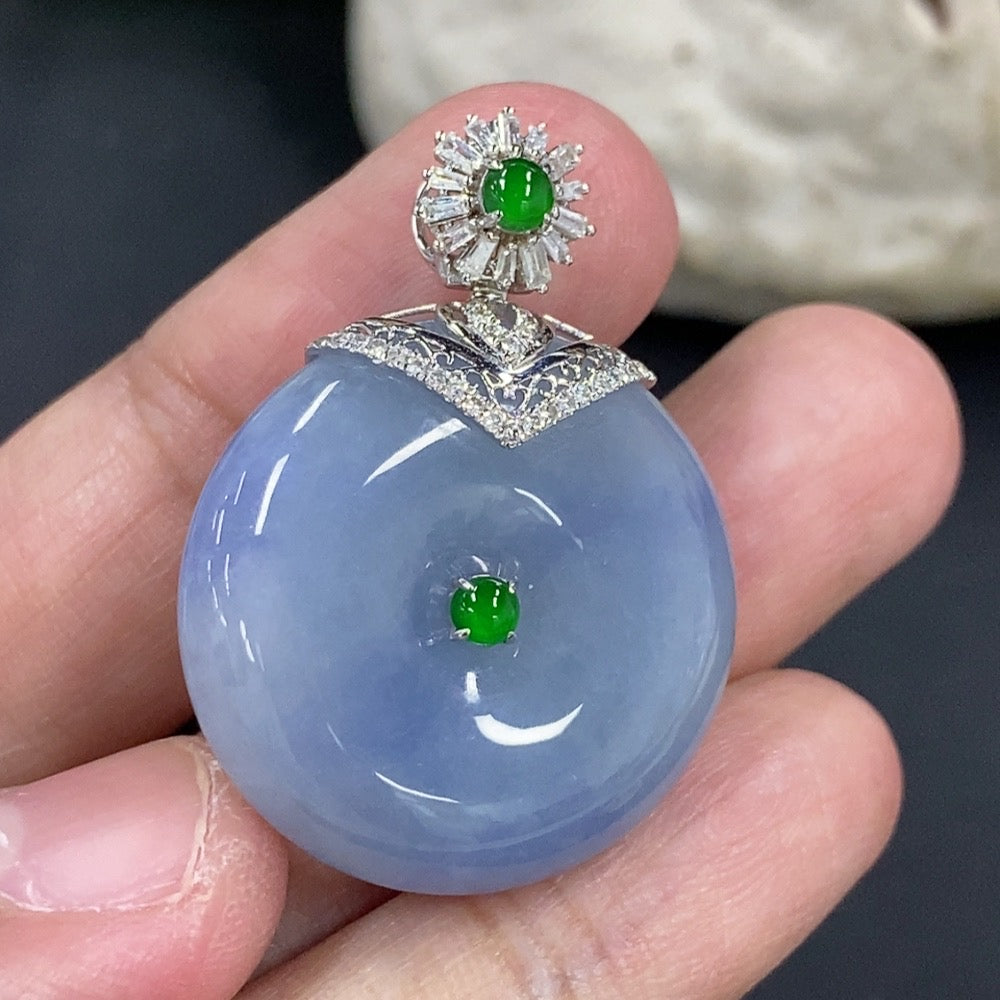 Jadeite Peace Knot pendant with 18K gold clasp and diamond accents, showcasing intricate design and smooth jade surface.