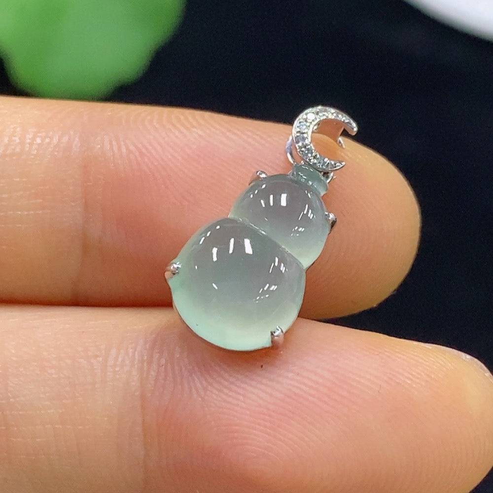 Jadeite gourd pendant with 18k gold inlay and diamond accents, crafted by HUILIU HQ, showing intricate design and polished surface.