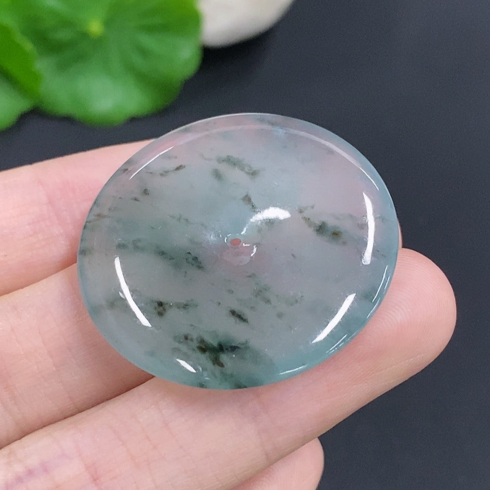Jadeite Peace Knot jewelry piece weighing approximately 10.7g, featuring intricate design and vibrant green jadeite stone.