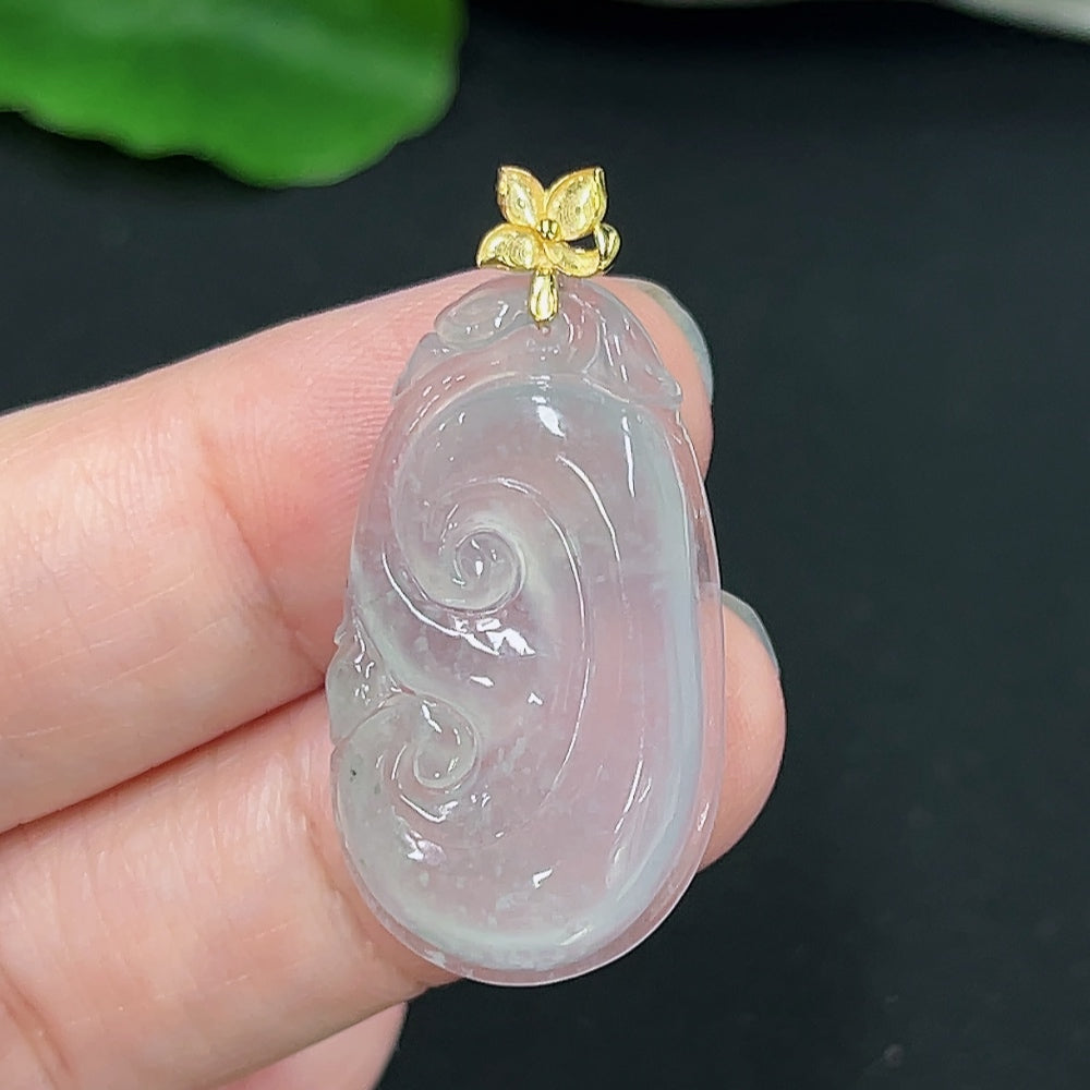 Jadeite Ruyi pendant with 18K gold setting, showcasing intricate design and polished jadeite stone on a delicate necklace.