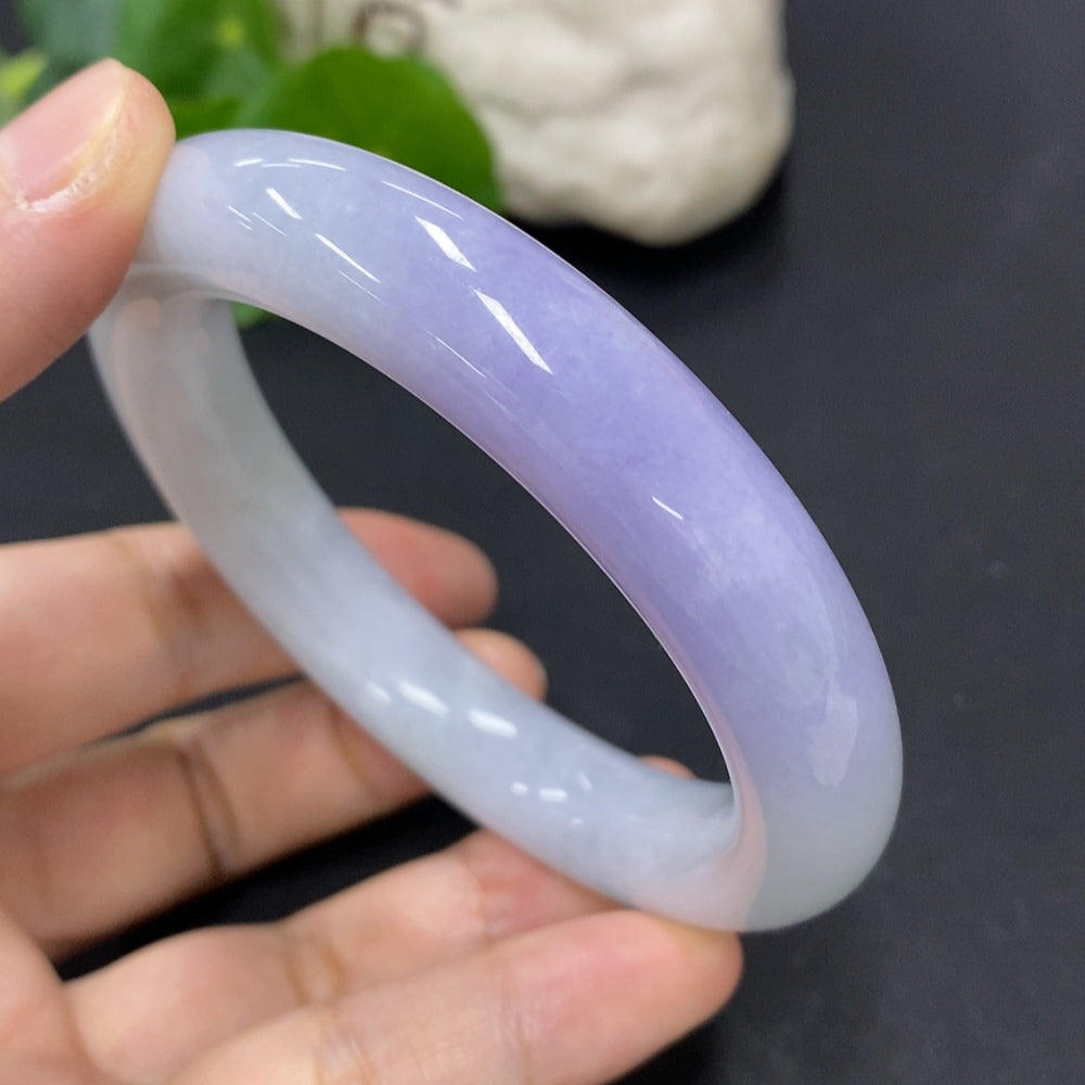 HKHQ jadeite round bangle in size 56.3 with a weight of 77.3g, showcasing smooth, polished jadeite bracelet on a neutral background.
