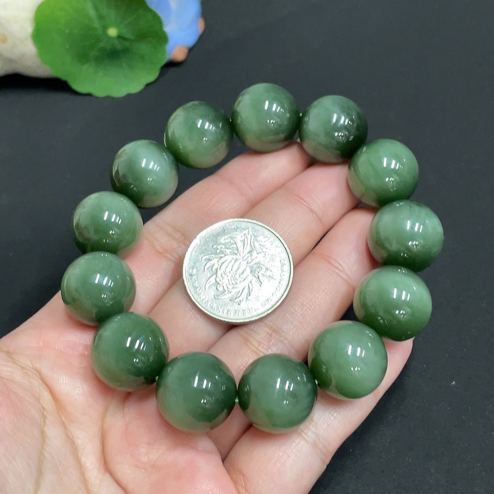 Hetian jade bead bracelet with 16.2mm jade beads, showcasing natural green hues and polished surface, weighing approximately 96.1g.