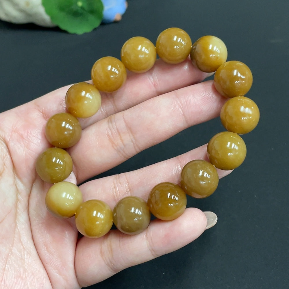 Huiliu certified Hetian jade bracelet with 13.9mm round jade beads, showcasing smooth, polished green jade jewelry.
