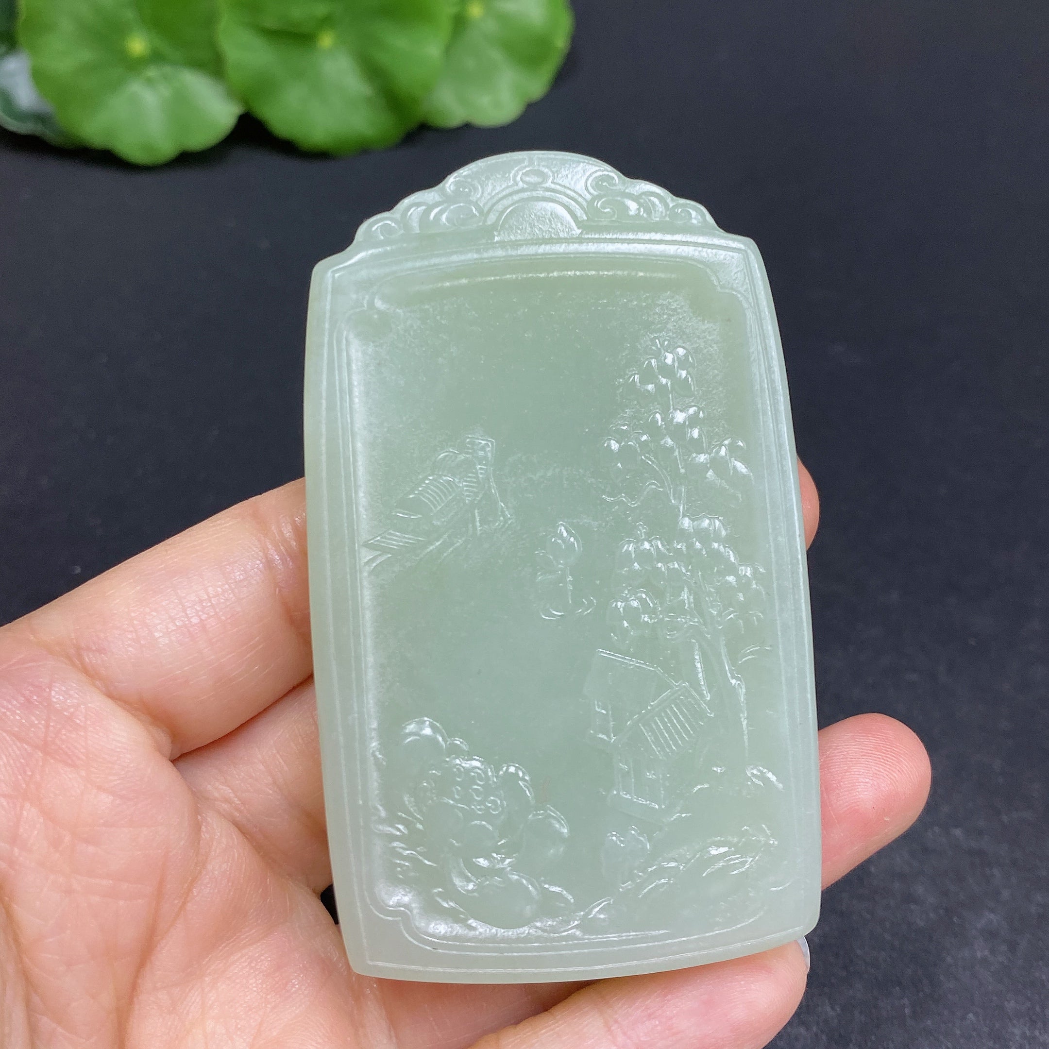 Huiliu Certified Hetian Jade Pendant featuring Guanyin figure, smooth polished surface, and intricate carved details.