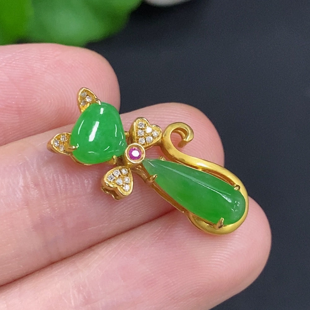 Jadeite pendant with diamond accents on 18K gold chain, elegant necklace featuring a polished jadeite gemstone.