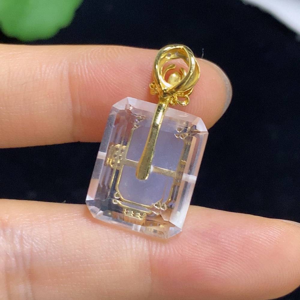 Jadeite pendant with 18k gold and diamond accents, showcasing a polished green jade stone and intricate gold detailing.