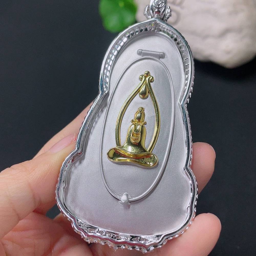 Jadeite inlaid Guanyin pendant with 18k gold and diamond accents, featuring intricate design and detailed craftsmanship.