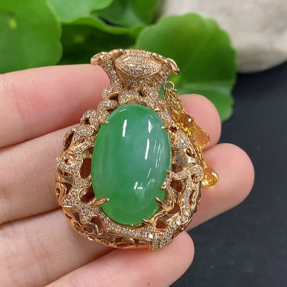 Jadeite pendant with 18K gold setting and diamond accents, elegant necklace featuring a polished green jadeite stone.