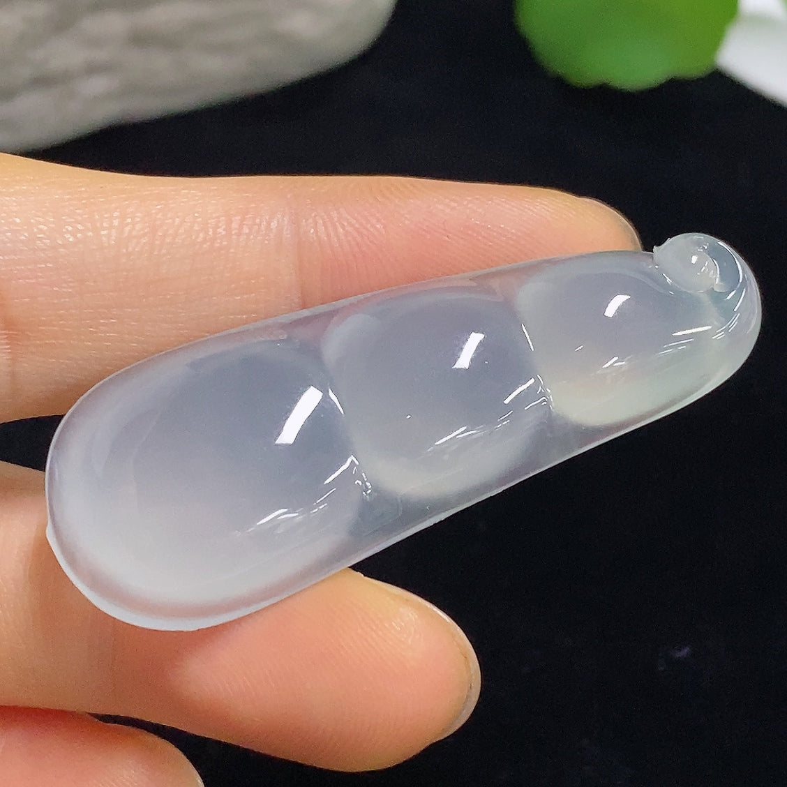 Jadeite pendant with Fu Dou design, weighing approximately 9.8g, handcrafted by HKHQ, featuring smooth green jade stone.