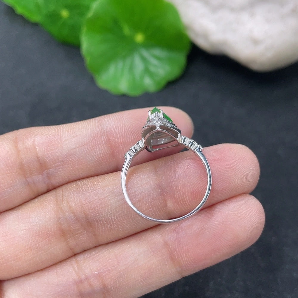 Jadeite ring with 18K gold band and diamond accents, size 13, from HKHQ, showcasing intricate design and shimmering details.
